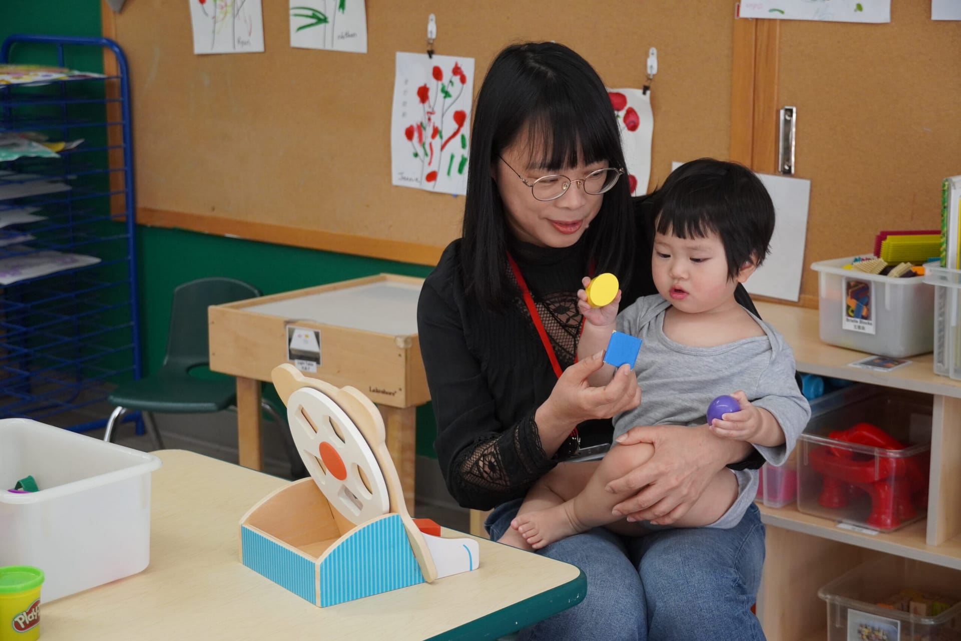 CASL teacher playing with baby